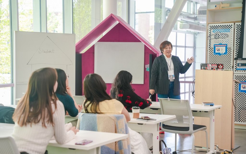 Frances Sun speaking to students in a design studio classroom at the Siebel Center for Design.